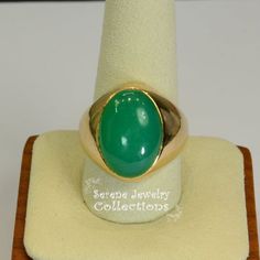 A  beautiful simple Chrysoprase cabochon is the centerpiece of this 14k gold ring. It is rare to find chrysoprase in such fine green and even color tone! Ring Size: 9.5Total Weight: 11.5 gramsPrecious Metal: 14k Yellow Gold Precious stones:-Chrysoprase Center Stone: 12.2 carats, 18.6mm x 13.3mmHallmark: 14k Gold Vintage Ring, Chrysoprase Ring, Color Tone, 14k Gold Ring, Vintage Ring, 2 Carat, Colour Tone, Precious Metals, Vintage Rings