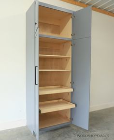 an empty storage cabinet with shelves in the middle