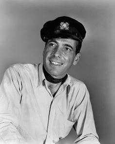 black and white photograph of a man wearing a hat