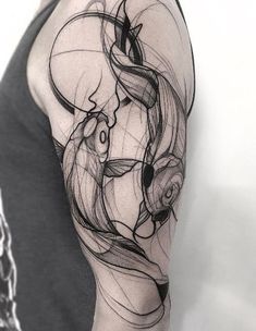 a black and white photo of a woman's arm with an abstract design on it