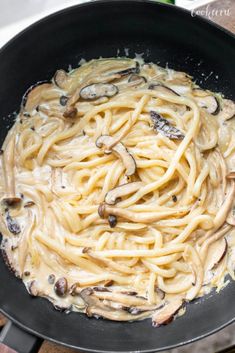 pasta with mushrooms is cooking in a skillet