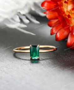 This vintage-inspired engagement ring is a true testament to timeless elegance, crafted with meticulous detail in 14K gold. The ring features a stunning emerald, creating a captivating focal point that symbolizes renewal and enduring love. The incorporation of sterling silver complements the vintage aesthetic, while the low-profile solitaire setting adds a touch of sophistication and subtlety. Designed for various occasions, from engagements to weddings, anniversaries, promises, or as a birthstone ring, this piece is versatile and meaningful. The incorporation of the emerald not only adds a pop of color but also carries significance as a birthstone for those born in May or as a symbol of rebirth and loyalty. Available Birthstones: *January (Garnet): A deep red gemstone symbolizing friendsh Classic Emerald Ring For Promise, Promise Emerald Cut May Birthstone Ring, Emerald Cut Promise Ring In Emerald, Green Solitaire Birthstone Ring With Emerald Cut, Green Emerald Cut Solitaire Birthstone Ring, Heirloom Emerald Cut Solitaire Birthstone Ring, Classic Green Jewelry For Promise Occasions, Timeless Emerald Ring For Anniversary, Solitaire Emerald Cut Emerald Wedding Ring