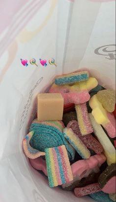 a bag filled with lots of different colored candies