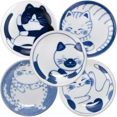 four blue and white plates with cats on them