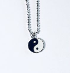 "Yin & Yang necklace, Yin and Yang necklace, unisex black and white with silver charm, on a ball chain necklace which is STAINLESS STEEL. Boho chic bohemian. Occult esoteric jewelry 💕 Yin & Yang is a concept of dualism with its roots in Taoism/ philosophy. The Yin or dark side is associated with shadows, femininity & the trough of a wave, the Yang or light side represents brightness, passion & growth, both sides present duality, both sides work together. *this is a super cute ne Symbolic Black Necklace With Adjustable Chain, Symbolic Black Jewelry With Adjustable Chain, Black Symbolic Jewelry With Adjustable Chain, Trendy Black Sterling Silver Necklace, Symbolic Black Stainless Steel Necklace, Black Clavicle Chain Charm Necklace, Trendy Black Nickel-free Necklace, Black Sterling Silver Nickel Free Charm Necklace, Adjustable Black Sterling Silver Charm Necklaces