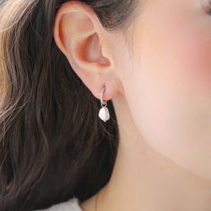 Does not tarnish! Elevate your everyday look with our AUDREY Earrings. Made of sterling silver these freshwater earrings offer a polished, radiant shine that complements any outfit. Lightweight and hypoallergenic, they provide all-day comfort, making them ideal for sensitive ears. Whether you're dressing up for a special occasion or adding a touch of sophistication to your everyday look, these earrings are the perfect choice. Make a subtle yet stylish statement with these beautiful earrings! Sterling Silver Teardrop Pearl Earrings For Everyday, Everyday Sterling Silver Teardrop Pearl Earrings, Everyday Hypoallergenic White Gold Pearl Earrings, Silver Huggie Pearl Earrings For Everyday, Everyday Sterling Silver Huggie Pearl Earrings, White Teardrop Huggie Earrings Hypoallergenic, White Hypoallergenic Teardrop Huggie Earrings, Silver Pearl Drop Huggie Earrings As Gift, Hypoallergenic Drop Pearl Earrings In Sterling Silver