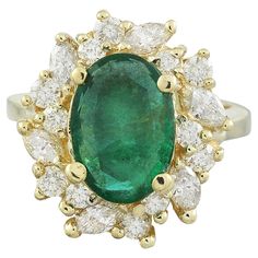 4.67 Carat Natural Emerald 14 Karat Solid Yellow Gold Diamond Ring Stamped: 14K Total Ring Weight: 8.1 Grams Emerald Weight 3.57 Carat (12.00x10.00 Millimeters) Diamond Weight: 1.10 carat (F-G Color, VS2-SI1 Clarity ) Face Measures: 19.15x18.00 Millimeter SKU: [600862] Gia Certified Yellow Gold Cluster Ring, Gia Certified Gold Cluster Jewelry, Yellow Gold Gemstones With Halo Setting For Anniversary, Anniversary Yellow Gold Gemstones With Halo Setting, Gia Certified Yellow Gold Emerald Ring For Formal Occasions, Luxury Cluster Emerald Ring In Yellow Gold, Luxury Yellow Gold Cluster Emerald Ring, Formal Gia Certified Yellow Gold Emerald Ring, Gia Certified Marquise Yellow Gold Jewelry