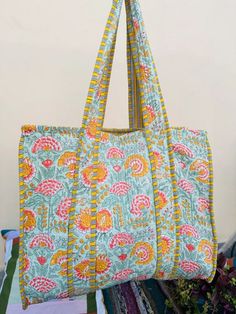 Perfect GIFT FOR HER The Indian Hand Block Printed Cotton Quilted Women's Handbags from Rajasthan India. This Handbag is completely Indian Printed on good quality cotton. Cotton quilted travel Bag made by Indian Artisans, this cotton quilted shopping bag is totally unique and multi purpose. Use this for your grocery or as a travel bag. Perfect to suit all. Item :- Cotton Handbag Material: 100% Cotton Pattern: Floral Print Was Care - Home Washable Style: Tote Bag Color - As Shown In Picture Zipper - Yes Size in Inch:- Height-15" inch Width- 18" inch Handle-13" inch Product Work: Printed & quilted Stitched Usage : Cosmetic, Make-up, Travel, Toiletries, Medicine, Accessories, Shopping and much more. Perfect for Beach Visits/ Quick Grocery runs/ Carrying Kids items/ Artist Paint book and Paint Angelina Core, Bags And Totes, Wrap Armband, Cotton Handbag, Quilted Tote Bags, Red Quilts, Handmade Tote, Travel Tote Bag, Tote Bags Handmade