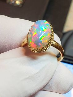 Natural crystal opal, galaxypattern, 10x14mm 5.75cts bright with purple background, rainbow slashes of fiery colors mounted on a 14k solid gold gallery style bezel ring . Gold Gallery, Natural Opal Ring, Ring Guard, Ring Crystal, Ring Opal, Bezel Ring, Crystal Opal, Purple Background, Star Ring