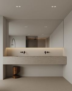 an empty bathroom with two sinks and mirrors on the wall next to it is illuminated by recessed lights