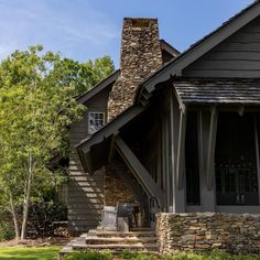 a house with stone steps leading up to the front door