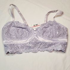 Lavender Bralette With Hook And Eye Closure. Adjustable Straps. Fully Lined. Pretty, Scalloped Lace Detailing With A Satin Trim. 90% Nylon And 10% Spandex. Hand Wash. Elegant Purple Bra For Spring, Elegant Purple Summer Bra, Purple Fitted Bra For Spring, Spring Purple Lace Bra, Feminine Fitted Lavender Bra, Fitted Lavender Bra For Spring, Lavender Feminine Bra, Free People Bralette, Free People Intimates