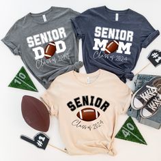 "Get ready for game day in style with our senior football family shirts! These custom football tees are the perfect way to show off your team spirit and support your senior football player. Whether you're a proud senior football mom or a football dad, our matching shirts are designed to help you cheer on your player in comfort and style. With our class of 2024 design, you can proudly display your senior's graduation year while showing off your love for the game. Don't miss out on the opportunity to create lasting memories and show off your football pride with our senior football family shirts. Grab yours today and get ready to cheer your team to victory! PRODUCT DETAILS:      *Unisex Bella and Canvas T-shirt      *Solid colors are 100% cotton except Ash - 99% cotton and 1% polyester      * Senior Mom Football Shirt Ideas 2024, Senior Football Mom Shirts 2025, Senior Mom Football Shirt Ideas, Senior Football Mom Shirts, Football Family, Football Ideas, Football Shirt Designs, Senior Football, Senior Shirts