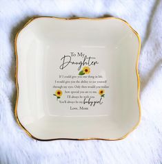 a white and gold plate with a poem on it