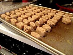 a pan filled with food sitting on top of a stove