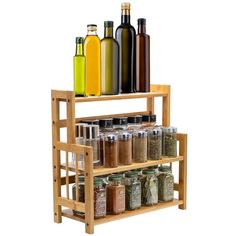 a wooden spice rack with spices and bottles on it's sides, in front of a white background