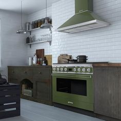 a green stove top oven sitting inside of a kitchen