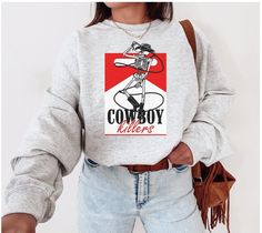 Trendy Cowboy Killer Sweatshirt is a super cozy pullover, perfect for the Wild West Aesthetic. Perfect pullover for any Country Music Concert or to throw on at a rodeo! Yee Haw Sizes are Unisex adult  50% cotton, 50% Polyester Machine wash inside out with like colors. Tumble dry on low to medium heat. Do not iron directly on image. Please refer to size chart for reference before purchasing. If you want an oversized fit, go up 1-2 sizes. Please feel free to message with any questions. Please note Cowboy Killer, Aesthetic Crewneck, Sweatshirt Western, Western Sweatshirts, Country Sweatshirts, Wearing Color, Country Outfits, Country Girls, Unisex Sweatshirt