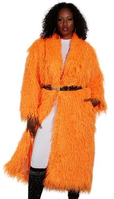 Introducing the Luxe Moda LM230 Church Coat, a garment that effortlessly combines style with comfort. This magnificent coat features a striking orange hue that is sure to turn heads and add a pop of color to any ensemble. Crafted from premium faux fur, the texture is both luxurious and eco-friendly, making it an exquisite choice for fashion-forward individuals. Designed to fall at a flattering mid-length, this coat provides ample coverage while still maintaining a sleek silhouette. Its loose fit ensures a comfortable wearing experience without restricting movement, making it perfect for a variety of occasions from formal church services to festive evening events. The open front and soft inner lining enhance the coat's cozy feel, while side pockets add a practical touch, allowing you to kee Orange Long Sleeve Outerwear For Spring, Oversized Orange Outerwear For Spring, Spring Oversized Orange Outerwear, Long Orange Outerwear For Fall, Long Orange Outerwear For Spring, Long Orange Spring Outerwear, Oversized Orange Outerwear For Work, Fur Design, Sleek Dress