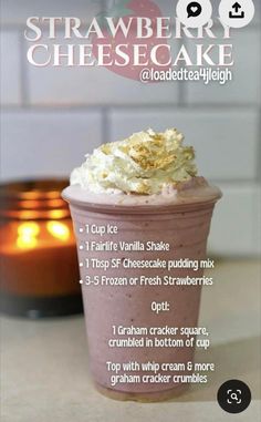 the recipe for strawberry cheesecake milkshake is shown in front of a candle