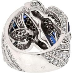 Immerse yourself in the world of luxury, where artistry and innovation converge in the Cartier 18K White Gold Diamond And Sapphire Dove Ring. This exquisite piece embodies elegance and grace, featuring a stunning dove motif crafted from 18K white gold, adorned with shimmering diamonds and vibrant sapphires. The intricate design captures the essence of love and freedom, making it a perfect symbol for cherished moments.Crafted by renowned designer Cartier, this ring is a testament to timeless beauty and exceptional craftsmanship. The diamonds and sapphires sparkle with every movement, creating a mesmerizing display of light and color. Whether worn as a statement piece or as a symbol of affection, this ring is sure to captivate hearts and turn heads wherever you go.Indulge in sophistication a Luxury Sapphire Diamond Ring With 17 Jewels, Luxury White Gold Sapphire Ring With Vvs Clarity, Formal Luxury Cartier Diamond Ring, Elegant Cartier Diamond Ring, Elegant Cartier Ring With Pave Setting, Luxury Sapphire Cluster Ring, Luxury Sapphire Birthstone Ring, Elegant Cartier Diamond Ring With Pave Setting, Elegant Cartier Cubic Zirconia Ring