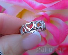 Hearts Love Sterling silver ring sizes 4-11 SOLID sterling stamped 925 silver Tarnish free 4 5 6 7 8 9 10 11 *IF YOUR SIZE ISNT SHOWING, MESSAGE ME. I might be sold out and will be able to replenish shortly* Top of ring height: 6.2mm Band width: 3mm Shank width: 2.4mm This is a High Polished solid sterling silver ring with Rhodium plating to prevent tarnishing. Nothing but the best from my custom jewelry store. --------------------------- Please follow care instructions. Any rings with stones, r Silver Stackable Promise Rings For Mother's Day, Silver Double Heart Ring For Mother's Day, Silver Heart Ring For Mother's Day Promise, Hypoallergenic Promise Ring For Valentine's Day, Silver Heart Ring For Mother's Day, Silver Stackable Rings For Anniversary On Valentine's Day, White Gold Stackable Rings For Valentine's Day Promise, Hypoallergenic Rings For Anniversary On Valentine's Day, Hypoallergenic Heart Ring For Anniversary On Valentine's Day