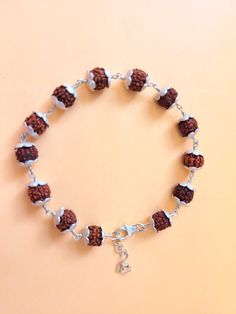 "Giglirigli Gems" Welcomes you "Valuable Rudraksha Bracelet, Gemstone Bracelet, Brown Statement Bracelet, 925 Sterling Silver Jewelry, Anniversary Gift, Bracelet For Wife" Metal : 925 Sterling Silver Pearl Pendants https://www.etsy.com/shop/Giglirigligems?ref=seller-platform-mcnav&search_query=Pearl+pendants Pearl Earrings https://www.etsy.com/shop/Giglirigligems?ref=seller-platform-mcnav&search_query=Pearl+earrings Pearl Ring https://www.etsy.com/shop/Giglirigligems?ref=seller-platform-mcnav&search_query=Pearl+ring A complete hub of Silver/Gold Jewelry & Gemstone Manufacturing Our Ability - 1000 Pieces per week &CAD/CAM Designing,Wire Wrapped Jewelry ,Rhodium Plating ,Micron plating,Grain Setting etc We are any Design as per your Requirement Payment policy We accept the payment via paypal Adjustable Sterling Silver Beaded Fusion Bracelets, Handmade Beaded Bracelets In Sterling Silver With Fusion Style, Spiritual Sterling Silver Bracelets With Silver Clasp, Adjustable Silver Bracelets For Festivals, Nickel-free Sterling Silver Rosary Bracelet, Adjustable Silver Spiritual Bracelets, Silver Adjustable Spiritual Bracelets, Adjustable Silver Spiritual Bracelet, Spiritual Sterling Silver Beaded Bracelets