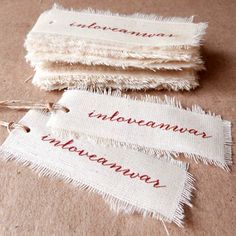 three pieces of cloth with words written on them