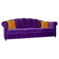 a purple couch with two orange pillows on the back and one yellow pillow on top