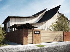 an architectural rendering of a building with a wooden fence and brick walls on the outside