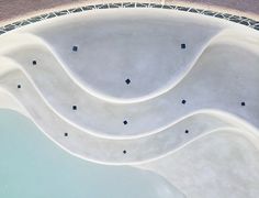 an aerial view of a skateboard park with ramps