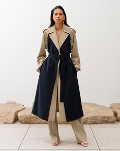 The Bricolage Trench Coat¬¨‚Ä†is constructed from a deconstructed trench coat, making it in shape of a coat again. The body layer of the coat comes in beige, and it comes with navy front pieces layered on top suggesting as 2-pieces of trench coat is combined. Comes in classic trench coat silhouette in longer length, and retaining trench-specific details such as epaulettes and sleeve straps, yet the style is updated into a modern look with dynamic sleeve drapes and the shaping at the waist. Butto Look Working Girl, Resort 2023, Classic Trench Coat, Elegante Casual, Looks Black, Abayas Fashion, Trench Coats Women, Coat Fashion, Fashion Show