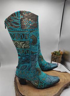 Hi, These are handmade genuine leather custom made cowboy style women's boots. Made with naturel leather, chenille fabric, ykk zipper. There is every size is available, 6 us to 11 us, 36 eu to 43 eu. There is heel 1 inches, 2.5 cm. ** If you need wider calf pleasse send us your calf circle measurments. To make custom order no extra charging. Boots height is knee high. There is ethnic pattern on turquoise boots. Waterproof. Very comfy and useful. We have door to door express shipping service. İf Bohemian Winter Boots With Snip Toe, Bohemian Snip Toe Winter Boots, Bohemian Winter Snip Toe Boots, Bohemian Snip Toe Boots For Festival, Bohemian Snip Toe Festival Boots, Fitted Bohemian Winter Boots, Western Style Blue Festival Boots, Handmade Bohemian Boots For Fall, Blue Western Festival Boots