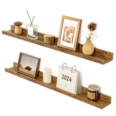 two wooden shelves with pictures and candles on them