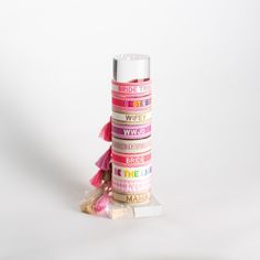 a stack of pink and white tape stacked on top of each other in front of a white background