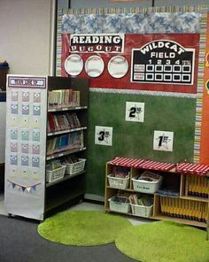 a baseball themed display in the corner of a room with bookshelves and bins