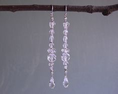 "Beautiful extra long crystal earrings are made with faceted clear crystals accented with silver. They dangle 3\". ❖  Crystal Passions crystals ❖  Celestial crystals ❖  Czech crystals ❖  sterling silver ❖  silver fill ❖  clear flexible cord Earrings shown in photos are on french hooks and posts. All earring types are sterling silver with the exception of clip-ons, which are silver plated. Hypoallergenic french hooks are stainless steel." Cord Earrings, Long Crystal Earrings, Celestial Crystal, Crystal Dangle Earrings, Czech Crystal, Clear Crystals, Etsy Earrings Dangle, Austrian Crystal, Clear Crystal