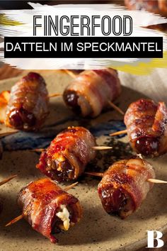 bacon wrapped dates on skewers with toothpicks in the foreground and text overlay reading fingerfood daten im peckantel