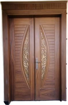 two wooden doors with intricate carvings on them, one is open and the other has a sidelight