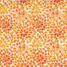 an orange and yellow flower pattern on white fabric