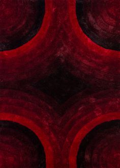 a red and black rug with circles on it