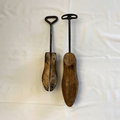 Two Vintage Wooden Shoe Stretchers with Metal Crank, Sold Separately The vintage shoe stretchers are made from wood and metal. Also know as shoe expanders, these tools were used to stretch or expand the leather in a shoe to make it more comfortable to wear. SOLD SEPARATELY: one men's size 0 shoe stretcher for shoe size 8 1/2-10 and one women's size 3 shoe stretcher for shoe sizes 4 1/2-6. Both stretchers have a metal crank screw rod mechanism to open and close the stretcher. Each has a nice aged patina. One men's size 0 shoe stretcher for shoe size 8 1/2-10. The wood shoe on the stretcher is approx. 9 1/4" long, 3" wide when closed. It is impressed with size "0".  It is marked with a stamp "OIL ALL MOVING PARTS" and a markers mark that is hard to read but may be a Belcher mark. The conditi Wall Mounted Key Holder, Shoe Stretcher, Wood Shoe, Vintage Shoe, Wooden Shoe, Wood Shoes, Cleaning Items, Wooden Shoes, Shoe Insoles