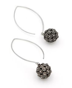 Textured beads burst with countless lotus flowers! Each bead is featured on a dainty and delicate threader-style earring hook. This beautiful accessory is made of Hill Tribe Silver, a style and material traditional to the Karen Tribe of Southeast Asia. Hill Tribe silver has a silver content equivalent to or higher than sterling. 94% to 98% of Hill Tribe silver is pure! Earrings measure about 2 inches long from the apex of the earring to the bottom of the lotus bead. The bead is about 0.5 inches Elegant Beaded Drop Earrings With French Hook, Elegant Adjustable Flower Shaped Beaded Earrings, Elegant Adjustable Flower Earrings With Round Beads, Elegant Adjustable Flower Earrings With Dangling Beads, Buddha Groove, Lotus Design, Hill Tribe Silver, Earring Hook, Lotus Flowers