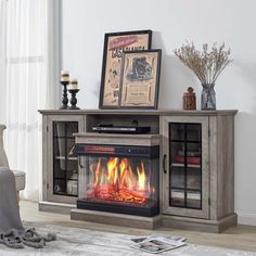 an entertainment center with a fire place in it