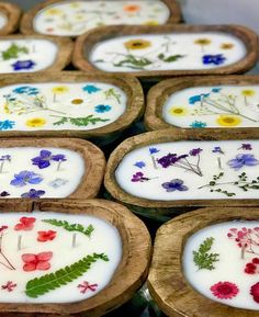 several wooden trays with flowers painted on them