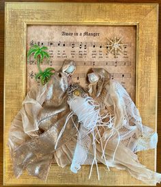 an altered photograph of some fabric and other things in a frame with music notes on it