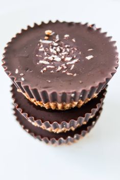 three pieces of chocolate sitting next to each other on top of a white countertop