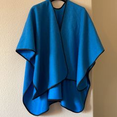 Wool Pancho One Size Blue 29” Tall, Easy To Carry, Multiuser, Can Be Use As A Blanket Too, Easy To Fold. 65% Polyester, 35% Wool, New With Tag. Wzancona Boutique’s Tag. 1b Traditional Blue One-size Poncho, Traditional Blue Poncho, Bohemian Blue Cape Poncho, Cape Sweater Ponchos, Blue Plaid Blanket, Blue Cozy Poncho One Size, Multicolor One-size Poncho For Outdoor, Fur Trimmed Cape, Aztec Sweater Cardigan