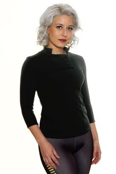 Product Details Adventure amongst the stars in style with our Space Rebel Top! Inspired by some of our favorite space adventuring heroes, rebels, and smugglers, the Space Rebel Top features a mandarin-style collar, double-breasted flap neckline, and 3/4 sleeves. Feeling a bit imperious? Wear the inner flap up and speak with a British accent. Fit Details Fit: Our Space Rebel Top hugs your torso with a light cotton blend that is soft and smooth! Made from a luxurious Turkish cotton, this jersey kn Galaxy Clothing, Galaxy Outfit, Cassian Andor, Geeky Clothes, Jyn Erso, Chic Over 50, Black Tunic Tops, British Accent, Geek Fashion