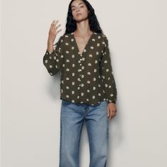 Long Sleeve V-Neck Top. Contrast Embroidery Detail. Front Button Closure. 7973/824 Zara V-neck Tops With Buttons, Zara Green Blouse With Buttons, Chic Floral Embroidery Button-up Top, Chic Floral Embroidered Button-up Top, Zara Button Blouse For Spring, Casual Workwear Blouse With Floral Embroidery, Zara Spring Blouse With Buttons, Zara V-neck Blouse With Buttons, Casual Button-up Blouse With Floral Embroidery